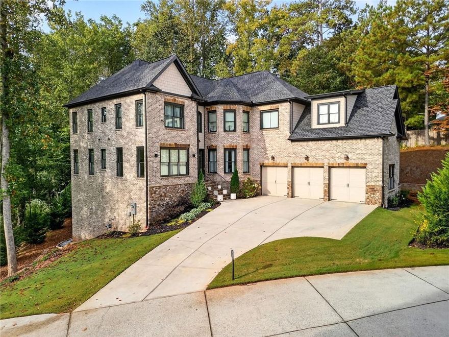 Welcome to this stunning custom residence where thoughtful design and timeless luxury meet. At the heart of the home is a chef’s dream kitchen featuring a smart Jenn-Air oven controllable from your phone, seamlessly integrated Thermador refrigerator and dishwasher, a beverage refrigerator, and a microwave drawer. The oversized quartzite island, raised for comfort and crafted with a sophisticated mitered edge, serves as both a designer showpiece and the hub for gatherings. High-end Brizo fixtures, true wood floating shelves, and a seamless connection to the family room complete this exceptional space.

Every detail of the home has been elevated, from 8-foot doors on the main level to the striking double-sided limestone fireplace that anchors the living areas. The powder room features a custom vanity with a six-inch miter edge, designed to impress with its statement-making style.

The primary suite offers a private retreat with a generous seating area, custom His & Her closets, and a dream-worthy closet complete with a six-foot island and a dedicated lounge for journaling or makeup. The spa-inspired bath includes an oversized Kohler soaking tub framed by floating shelves and natural sunlight, a steam shower with bench and cubby storage, and a 60-inch vanity with elegant detailing. Gold Brizo fixtures throughout add a touch of daily indulgence.

Home features abundant natural lighting throughout, creating a bright and inviting atmosphere. Equipped with smart garage door openers for added convenience and modern living.

Additional highlights include a beautifully appointed Jack & Jill bathroom with floor-to-ceiling tile, a custom powder room vanity, and luxury finishes that set this home apart.

This property is more than a home—it’s a lifestyle, offering sophistication, comfort, and thoughtful design at every turn.