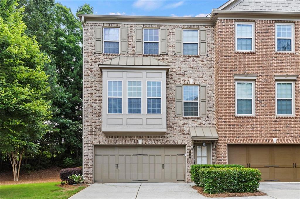 Situated in the highly desirable Peachtree Corners community, this beautifully maintained end-unit townhome offers the ideal blend of privacy, location, and low-maintenance living. Nestled in the quiet Greenwood Townhome Community, this spacious 4-bedroom (one of the few true 4 bedrooms in the neighborhood, most are only two or max three), 3.5-bath home backs up to a wooded area and is bordered by a large green space (also note this home has an amazing side yard like no others in the neighborhood), providing a rare sense of seclusion while remaining just minutes from The Forum, Peachtree Corners Town Center, Downtown Norcross, and major commuter routes including I-85, I-285, and GA-400.
Inside, you’ll find a well-designed layout, featuring hardwood floors on the main level and new LVT flooring throughout the rest of the home. The open concept living area is anchored by a cozy fireplace and flows effortlessly into the dining area and a spacious kitchen with stainless steel appliances, granite countertops, and a center island, ideal for entertaining or everyday living.
Step outside to the private rear deck, complete with a retractable awning, perfect for grilling, relaxing, or enjoying peaceful wooded views. Natural light pours through the home’s many windows, creating a bright and welcoming atmosphere throughout.
Upstairs, the owner’s suite features a spa-inspired bathroom with a soaking tub, dual vanities, and a walk-in closet. Two additional bedrooms, a full bath, and a laundry room complete the upper level. The finished terrace level includes a large fourth bedroom with a full bathroom.
Whether you’re looking for comfort, convenience, or community, this home checks every box. Peachtree Corners is one of Metro Atlanta’s fastest-growing and most desirable communities, known for its family-friendly atmosphere, expanding business and technology hubs, and a wave of new construction and redevelopment projects. The Town Center serves as a lively gathering space, featuring restaurants, retail, a performance green, splash pad, and events year-round, offering a true sense of community and convenience.
Don’t miss this rare opportunity in one of metro Atlanta’s most sought-after, rapidly growing communities. Schedule your private showing today.