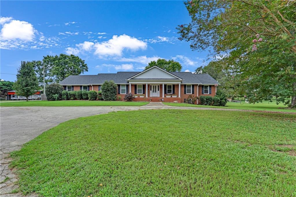 Charming all Brick Ranch on 7-Acre Horse Farm with Pool & Barn This all-brick ranch sits on a full unfinished basement and offers the perfect blend of country living and modern comfort. Sits on 7+ acres, the property is designed for equestrian and animal enthusiasts with a riding arena, multiple cross-fenced pastures, and a six-stall barn complete with water and electricity. The home features 3 spacious bedrooms, 2.5 baths, a flex room could be used as a 4th bedroom, a formal living room, formal dining room, and a large great room ideal for gatherings. Step out onto the covered back porch to take in views of the pool and barn, or entertain by the grilling pavilion beside the inground Gunite pool. Whether you're looking to manage horses, raise other animals, or simply enjoy private country living, this property has it all!!