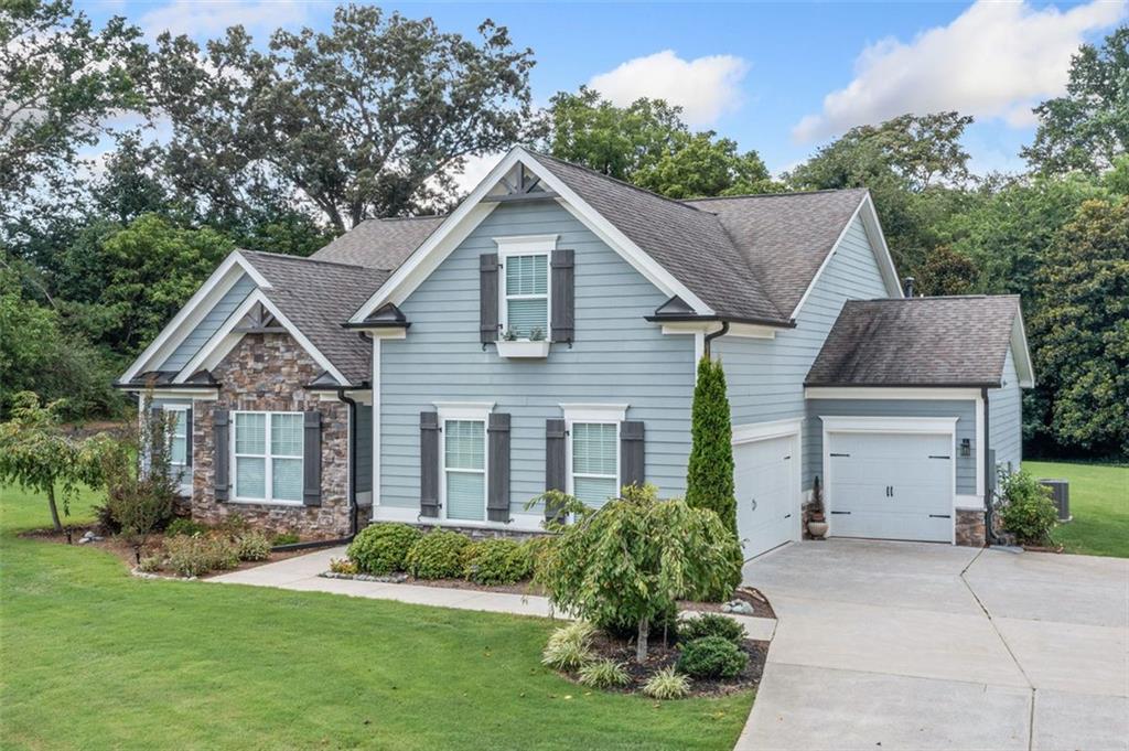 This exceptional four-bedroom, three-bathroom Stonecrest home blends comfort, style, and functionality in perfect harmony. From the moment you step inside, you’ll discover an inviting layout designed for modern living, with spacious rooms and thoughtful details throughout. The open and airy interior features generously sized bedrooms, each with large walk in closets for ample storage. The primary suite offers a private retreat, while three additional bedrooms provide versatility for a home office or creative spaces. The upstairs room provides a private oasis with full bathroom, perfect for an in law suite or second master. Every bathroom is beautifully appointed with sleek tiled showers, creating a spa-like experience for your daily routine. Storage is abundant, with a convenient walk-in attic storage room and a three-car garage offering flexibility for vehicles, hobbies, or tools. Set on a large, beautifully lot, this property provides endless opportunities for outdoor enjoyment, entertaining, or future expansion. Enjoy the perfect balance of privacy and openness with room to relax, host gatherings, or design your dream outdoor oasis. The yard is equipped with a sprinkler system.Move-in ready and meticulously maintained, this home combines quality craftsmanship, thoughtful design, and exceptional convenience. Schedule your showing today and experience all it has to offer!