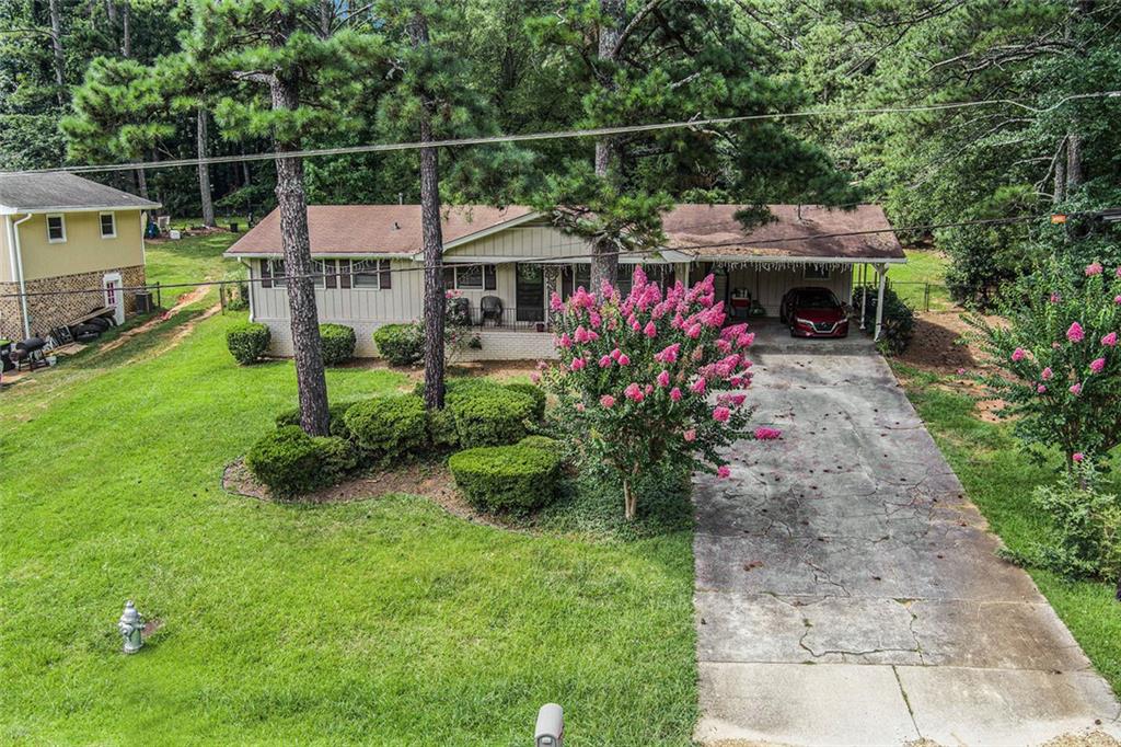 Welcome to this beautifully updated 3-bedroom, 2-bath ranch in sought-after Cobb County — with NO HOA! This move-in ready gem sits on a spacious, fenced lot, offering rare flexibility and functionality for today's homeowner or savvy investor. Enjoy a functional, flowing layout with updated finishes throughout. The expansive yard provides ample room for extra parking, large equipment, recreational vehicles, or even a future pool — making it ideal for buyers needing space and versatility. Situated along the Silver Comet Trail, this property offers a unique blend of privacy, convenience, and outdoor access. Currently tenant-occupied – do not disturb tenants – showings by appointment only.
Backyard bonus: a detached building sold AS-IS, perfect for storage, a future workshop, or renovation potential.
Whether you're looking for an investment property with immediate rental income or a future primary residence with room to grow, this home offers endless potential in a prime location!