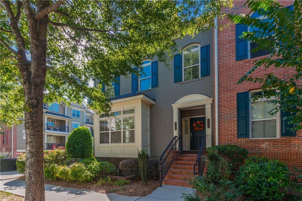 Beautiful Townhouse with Hardwood Floors (main), Brand New carpet in Bedrooms. Neutral Paint-throughout. Granite Counters/Breakfast Bar, Dark Cherry Oak Cabinets, Stainless Steel Kitchen Appliances, Abundance of Natural Lighting, Balcony off Kitchen, Fireplace, Contemporary Lighting, Wood Blinds, Stackable Washer/Dryer. Separate shower/tub in Master. Lower level Bedroom/Office has private Bathroom (Shower only). One Car Garage. Fantastic Location; Walk to Big Creek Greenway, Shopping, Restaurants. Quiet subdivision with lake & dog park next door.