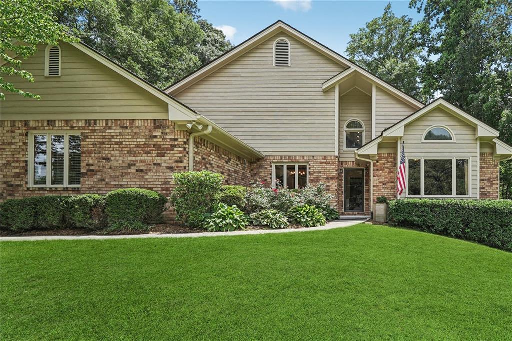 Beautiful 4-sides brick home offering a spacious and well-thought-out floor plan with no HOA! Step into a bright and open gourmet kitchen featuring granite countertops, solid oak cabinets, a gas stove, and a new dishwasher perfect for daily living and entertaining. Enjoy rich hardwood flooring throughout, a cozy family room with a gas fireplace with gas insert and blower, built-ins that add charm and functionality. The formal dining room is ideal for gatherings, While the screened-in sunroom offers a relaxing retreat during the warmer months, while convenient plexiglass windows help keep out pollen in the spring allowing you to enjoy the space comfortably year-round and the loft area/office provide flexible living space. The oversized owner’s suite includes a jacuzzi tub, tiled shower, and an attached bonus room with a full bath and an expansive closet. Secondary bedrooms offer ample storage with double closets and ceiling fans. Outside, unwind on your oversized back deck, surrounded by a private, professionally landscaped lot with landscape lighting. Additional features include a whole house fan, laundry room with sink and built-ins, 2018 roof, fresh exterior paint in 2022, and a large unfinished basement ready for your personal touch. This is a must-see home that blends comfort, functionality, and style!