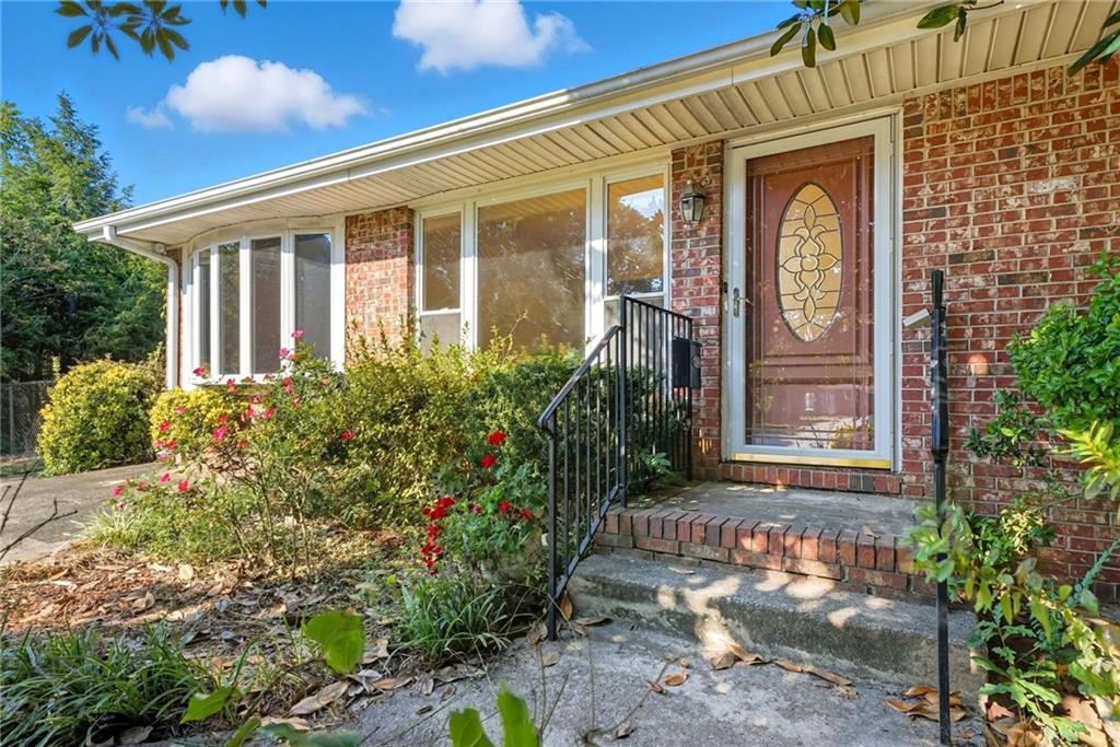 Vintage Charm Meets Everyday Comfort in Jonesboro. Step back in time but with all the right updates when you walk into this classic 1968 four-sided brick ranch. This home is full of character and charm, offering the kind of warmth you just don’t find in today’s builds. Inside, you will love the parquet hardwood floors that set the tone with vintage style. The spacious family room is perfect for movie nights or gatherings, while the separate dining room with a dry bar nook sets the scene for dinner parties or Sunday suppers. With three bedrooms and one and a half baths, the layout is practical yet cozy. Step out back and you will find a large deck overlooking your private backyard, ideal for summer cookouts or morning coffee. With the school right across the street, you can walk your children to school and enjoy the convenience of being only minutes from downtown Jonesboro. This home is for the buyer who craves character over cookie-cutter, a place with soul, stories, and timeless appeal. Come fall in love with its vintage vibe and start your next chapter here.