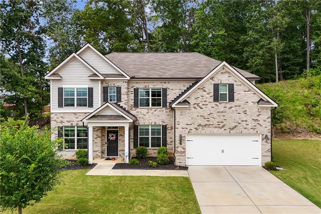 Welcome to 5065 Cooper Farm Drive, a stunning 4-bedroom, 3-bath home in the desirable Level Creek community of Buford. Built in 2021, this spacious residence offers over 3,200 sq ft of modern living with an open floorplan, 9’ ceilings, and designer finishes throughout.
The main level features a bright family room with fireplace that opens to the chef’s kitchen, complete with granite countertops, oversized island, stainless steel appliances, white cabinetry, and a breakfast area overlooking the backyard. A private office provides the perfect work-from-home setup, while the main-level guest suite with full bath is ideal for visitors or multi-generational living.Upstairs, the oversized owner’s suite offers a spa-style bath with dual vanities, soaking tub, walk-in shower, and generous closet space. Two additional bedrooms, a full bath, and a convenient upstairs laundry room complete the second level.Enjoy outdoor living on the covered patio overlooking the fenced backyard, perfect for gatherings or relaxation. Hardwood floors, neutral colors, and a 2-car garage add both style and convenience.Location is a true highlight—just minutes from Downtown Sugar Hill, Suwanee Town Center, Lake Lanier, and major highways (I-85 & I-985). Zoned to award-winning Lanier schools, this home offers both comfort and convenience in one of Gwinnett’s most sought-after areas.
Move-in ready and thoughtfully designed, 5065 Cooper Farm Drive is the perfect place to call home.