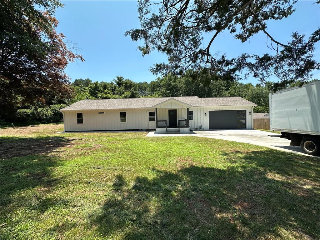 Welcome to this Beautiful Brand New Ranch. Come see this dream home on 0.712 Acre lot! This 3 BD and 2.5 BA has been fully Updated/Renovated from top to bottom including white kitchen cabinets, granite countertops (Quartz), stainless steel appliances. Hardwood floors. All bathrooms have been renovated. Huge master bedroom with walking-in closet. Laundry room. New water heater. New AC. New Roof. New Pluming. New electrical. New windows. New doors. New interior and exterior painting. Siding: Hardi Plank. New front porch. The 2 car garage (garage floor has been refinished with Epox). Private back yard with new wooden deck. This home is close to Interstates I-75 and I-575. Close to the Mall Town Center and easy access to parks, shops, and restaurants.