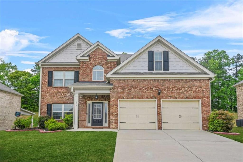 Welcome to luxury and contemporary living at its finest! This stunning 4-sided brick home offers 4 bedrooms, 2.5 baths, and a 2-car garage, combining elegance, space, and functionality. The oversized master suite is a true retreat, featuring a large spa-like bath with beautiful tile work, a soaking tub, a separate shower, and an impressive walk-in closet. The secondary bedrooms are all great sizes too. The formal dining room showcases a sophisticated coffered ceiling, adding charm and character to your gatherings. The heart of the home is the large kitchen, complete with granite countertops and stainless steel appliances Co perfect for the cook or chef of the family to create and entertain in style. Enjoy the spacious open family room with a fireplace designed for entertaining guests or relaxing with family. Every corner of this home is designed with style, comfort, and practicality in mind. This home is in Henry County School District.