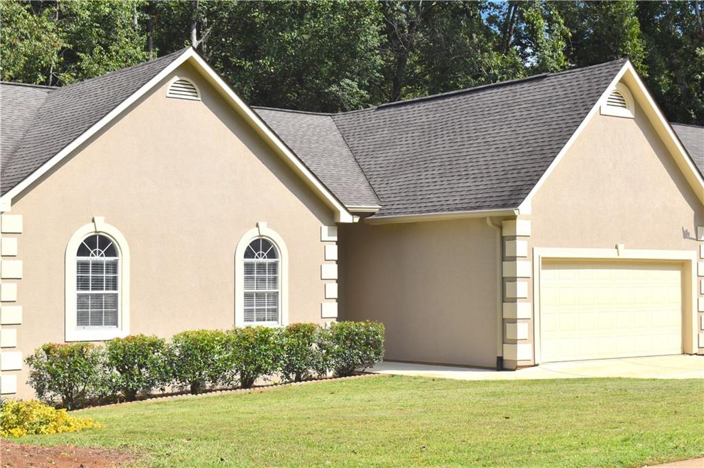 Welcome to the best rental property in the subdivision! This beautifully remodeled 3-bedroom, 2-bath home has been thoughtfully updated inside and out, offering modern style, comfort, and convenience. Step inside to find fresh interior and exterior paint, brand-new windows, and gorgeous new hardwood floors throughout. The chef’s kitchen is a showstopper with top-quality, energy-efficient appliances, sleek quartz countertops, a spacious island with extra cabinetry, and an open concept that flows seamlessly into the dining room and cozy breakfast nook—perfect for entertaining or everyday living.
The family room boasts a stunning fireplace, while the laundry room is equipped with cabinets and ample storage space. Both bathrooms have been fully redesigned with Italian tile, new vanities, updated fixtures, and in the master bath, a soaking tub, double vanity, and elegant finishes that create a spa-like retreat. All three bedrooms are conveniently located on the main level, each with large windows for natural light and oversized walk-in closets with custom shelving. Every detail has been considered—all lighting, hardware, and finishes are brand new. Additional highlights include:2-car garage, Full basement
Professionally landscaped yard, private, fenced backyard. Over $80,000 in upgrades were invested—no corners cut, no detail overlooked. And the location can’t be beat! You’ll be just minutes from top schools, hospitals, shopping, dining, parks, and highways—only 15 minutes to downtown and 20 minutes to Chateau Elan and Lake Lanier. This home has it all—style, convenience, and a location that delivers. Don’t miss your chance to see it today!