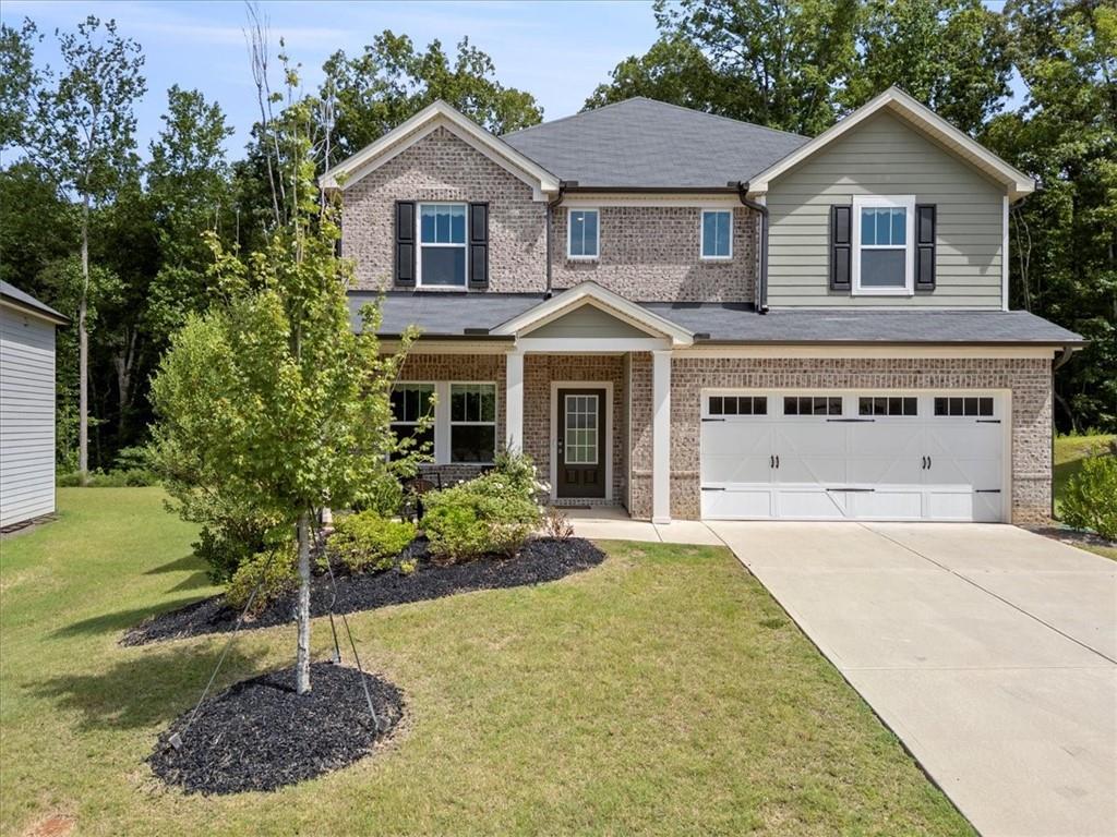 Welcome to 51 Longleaf Street — a spacious and beautifully maintained 5-bedroom, 3-bath home located in a highly desirable Dawsonville neighborhood! This home offers a flexible layout perfect for growing families, multi-generational living, or anyone who loves extra space. Enjoy an open-concept kitchen and living area ideal for entertaining, along with a full bedroom and bathroom on the main level. The upstairs features a generous owner's suite, plus three additional bedrooms and a full bath. Situated just minutes from the North Georgia Premium Outlets, dining, and top-rated schools, this home combines comfort, convenience, and location. Don't miss your chance to own this gem in the heart of Dawsonville!