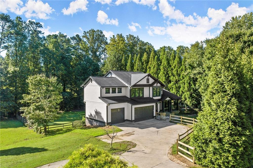 Tired of the same old, same old, cookie cutter home? Then this thoughtfully updated executive-style residence is what your family’s been craving…Sophistication, Comfort, and Freedom! Located in the East Cobb school district and designed with both elegance and functionality in mind…this home balances refined living spaces with modern upgrades at every turn.
Step in off the spacious custom stone front patio into a welcoming open 2 story foyer that flows seamlessly into the open family area...featuring large family room, upgraded open kitchen (new appliances, new quartz, modern cabinets, recessed lighting and functional island), breakfast/coffee nook, and eating area. The living room and dining room flow off the kitchen…creating a perfect layout for entertaining and everyday living. A dedicated office, remodeled half bath, impressive wood deck and 3-car garage wrap up the main level. Upstairs, discover an ample amount of space with a large landing area, four bedrooms and three full baths, including a luxurious custom primary suite with a sitting area, fully renovated bathroom (you’re going to love this...have you ever experienced a copper tub?), and customized closet. Three spacious secondary bedrooms feature updated baths and plush comfort with one being a large guest or teen suite w/ full bathroom.
The upgraded 1400 square foot basement reveals custom finishes throughout with a large entertainment area (TVs, custom bar with bar stools, sink, frig, and tasteful custom trim and paint), a bonus room (5th bedroom or theater room), nice unfinished area for storage, craft/workshop room, and yet another full bath. Additionally you’ll find access to the covered water proof stone patio, large fenced open backyard with a stone walkway to front of house. Extra features include solid wood doors throughout, updated lighting throughout, irrigation system, Epoxied garage floor, and new attic foam insulation. From the elegant finishes and thoughtful upgrades, to the large private lot, this home is ready to welcome its next owners with style, security, and plenty of room to live, work, and play.