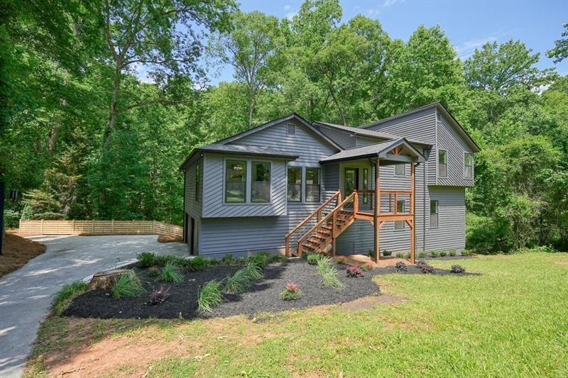 **ENJOY INSTANT EQUITY AND EXCEPTIONAL VALUE AS THIS HOME IS PRICED $60K BELOW APPRAISED VALUE!**
Welcome home to this meticulously renovated five bedroom, three bathroom contemporary home nestled on a quiet cul-de-sac in Stone Harbor subdivision. Enjoy your morning coffee on one of the two decks overlooking the tranquil creek beyond the newly fenced yard. The main level boasts an open floor plan with vaulted ceilings; an amazing chef's kitchen with stunning finishes that include quartz countertops, a massive island, all new stainless steel appliances, and gas range; and luxury vinyl plank grace the floors in the entire home. The kitchen and dining spaces open up into an expansive great room with a striking vaulted stone fireplace and outdoor deck. The upper levels contain two bedrooms and one shared bathroom with beautiful tile, new tub and vanity with quartz countertops. Down the hall is conveniently located the laundry area adjacent to the primary suite. The large primary suite has a stunning and relaxing spa wet room with dual headed shower and free standing bathtub. The double vanity has quartz countertops and top of the line gorgeous finishes. In addition, there is a spacious primary suite closet as well. The lower level has a family room flex space with french doors leading out to an expansive deck as well as two bedrooms and one full bathroom. The basement level consists of finished and unfinished areas with soaring ceilings for additional living, entertaining or work spaces. More windows were added by the seller to illuminate this great space. A new modern fence was added to the backyard to create your own private oasis.
This home boasts worry free maintenance since it has new everything! New Roof, HVACs, Water Heater, Doors, Windows, Garage Doors, Wood Decks, Fencing, Appliances, Lighting and Freshly Painted. No HOA.