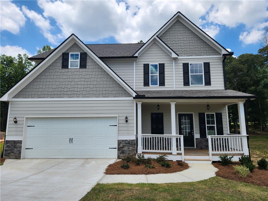 This stunning home is completed and ready for YOU! This home features a spacious open floor plan on an unfinished basement that can be customized later to suit your needs and preferences. Whether you want to create a cozy secondary family room, home office, gym, or a guest suite - the possibilities are endless. The main floor boasts an open concept design with LVP flooring in the foyer, kitchen, and breakfast area. The kitchen has granite countertops and stainless steel appliances, island and breakfast area. This space opens up to the living room with a wood burning fireplace. The owner's suite has a walk-in closet and a ensuite bathroom with a soaking tub and a separate shower. There are three more bedrooms and another full bath. This home is conveniently located close to schools, parks, and shopping. Builder has recently added sod in the back and is currently offering $4,000 seller paid closing costs with use of one of their preferred lenders. Move-In Ready, Built by Keystone Communities