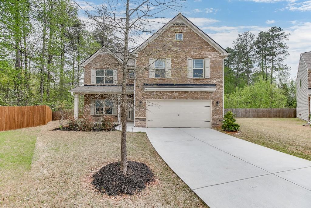 BACK ON MARKET DUE TO NO FAULT OF THE SELLER. Unique opportunity in Marietta. 4BR/2.5BA home in Powder Springs Village on a quiet cul-de-sac lot. Covered front porch welcomes you in to the beautiful entry way with a formal Dining Room just off the foyer. Continue in to the home to the open eat-in Kitchen with dark wood cabinetry, granite countertops, and stainless steel appliances. The Family Room has an arched entry and beautiful marble fireplace. Travel upstairs to the four spacious bedrooms. Master Suite offers trey ceiling and a Master Bath with soaker tub, dual vanities, separate shower and a large Master closet. Full hall bath and laundry room complete the upstairs. Outside, the extended patio overlooks the private fenced backyard. ** FIVE YEARS REMAINING ON STRUCTURAL WARRANTY FROM BUILDER**