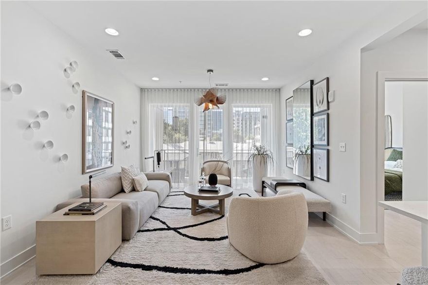 Welcome to your new home at J5, new luxury condominiums in the heart of Midtown! J5 offers ultimate Intown living: quality construction, convenient location, unmatched service, and luxurious amenities. This 2-bedroom, 2-bathroom home features an open-concept living and dining area, Midtown skyline views, and abundant natural light. This home is beautifully designed to maximize its space and boasts 2 complete bedroom suites. The primary suite has an attached private balcony, the perfect way to greet the day with your morning coffee or unwind while overlooking the picturesque Midtown skyline. Both bedroom suites have a sizeable walk-in closet, dual-sink vanities, integrated light mirrors, contrasting cabinetry with full overlay flat panel doors, and soft close features. State-of-the-art finishes continue throughout the home with wide plank hardwood flooring, KitchenAid appliance packages with gas cooking, and quartz countertops. Unwind on one of your balconies or head down to one of two clubrooms for fireside chats with neighbors. Soak up the sun next to the saltwater pool, or head over to the garden deck to pick fresh herbs for your home-cooked meal in your chef-inspired kitchen. Luxury conveniences continue with a 24-hour concierge, state-of-the-art fitness center, pet spa, and an open-air rooftop lounge!
