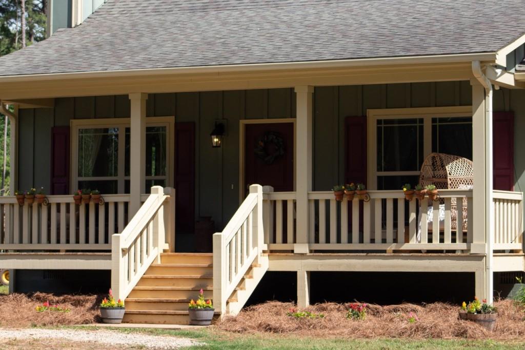 Charming Country Retreat on 10 Acres - Minutes from I-20 & Lake Oconee! Welcome to your peaceful paradise! This beautifully maintained 2 bed, 2 bath farm home sits on a sprawling 10-acre tract of fenced agricultural land--perfect for those looking for a small farm, space, privacy, and a true slice of the country lifestyle. Step onto the inviting front porch and enter into a light-filled open floor plan featuring luxury vinyl flooring, a cozy stone fireplace with hearth, and a stunning 5' granite island anchoring the spacious kitchen. Enjoy granite counter tops, modern appliances, and ample cabinetry--ideal for everyday living and entertaining alike. The primary suite offers a generous walk-in closet and private bath, while the split-bedroom layout ensures privacy for guests or family. Outdoors, the property truly shines. This home is zoned agricultural and is currently hosting goats, donkeys, horses and more. A wonderful farm. The tract is flat usable farm land with plenty of room to roam. There is also ample room for an RV or trailer to turn around. A barn and large shed also sit on this property. The shed is perfect for hobbies, storage or a creative studio. Over 3000 feet of invisible extreme dog fencing is another added bonus to this property. The property is fenced and the entrance is gated. Located just minutes from I-20, Shops, Lake Oconee Academy, and area amenities--yet surrounded by nature and serenity--this unique property is a rare find. Don't miss your chance to live the farm life without giving up convenience!