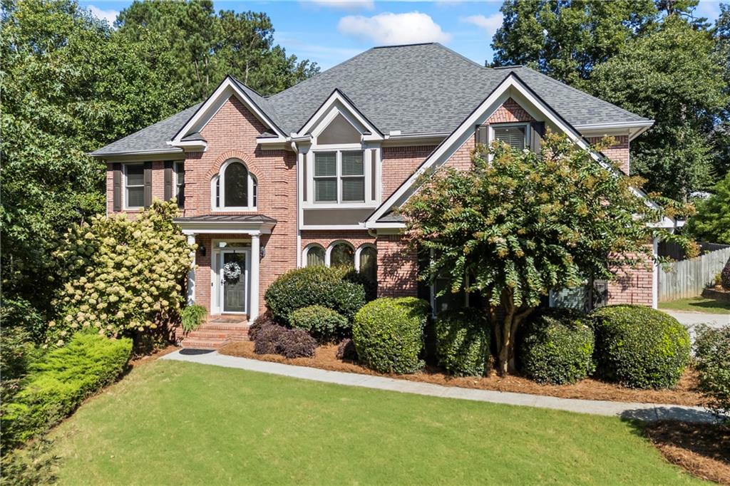 Stunning 4 Bedroom / 3.5 Bath Home with Finished Basement, Pool & Wrap-Around Deck in Collins Hill Cluster
Welcome to this beautifully maintained home in the highly sought-after Collins Hill school district! Offering timeless charm and modern functionality, this spacious residence boasts 4 bedrooms, 3.5 baths, and a fully finished basement—perfect for both everyday living and entertaining.
Step inside to find arched windows and entryways, a formal living room, and a dining room large enough to accommodate 12 guests. The bright kitchen features a breakfast area, hidden walk-in pantry (a fun surprise!), and easy access to the inviting family room with 18-foot ceilings, a wall of windows, gas fireplace, and floating shelves. A convenient half bath, laundry/mud room, and wrap-around deck complete the main level.
Upstairs, the primary suite is a true retreat with double-door entry, trey ceiling, and a sitting area. The spa-like bath showcases a custom shower and storage cabinet tower. Three additional bedrooms and two full baths provide plenty of room for family and guests.
The finished basement offers tiled flooring for easy care, a family/TV room, game room with built-in shelving, and endless possibilities with extra space for a gym, storage, or future pool room. It’s even stubbed for a bath!
Step outside to your own private oasis. The fenced backyard features a wrap-around deck overlooking natural green space, a nearly new above-ground saltwater pool, and a trampoline that stays with the home.
All of this in a prime central location—just minutes to Collins Hill High, the Mall of Georgia, Coolray Field, parks, shopping, dining, and major highways.
Don’t miss your chance to own this incredible property that blends elegance, comfort, and convenience!