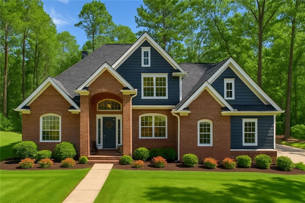 Welcome to the home you have worked so hard to deserve! A stunning 2-story brick home nestled on more than 3 acres of serene, wooded privacy, just minutes from a boat ramp to Jackson Lake. This peaceful retreat offers the best of both worlds: quiet country living with easy access to water recreation and modern conveniences. As you approach, a circular driveway with a second entrance welcomes you, offering ample space for RV or boat parking—a rare bonus for outdoor lovers! Step inside to a grand 2-story foyer and soak in the warmth of hardwood floors throughout the main level. The primary suite is conveniently located on the first floor, complete with his and her closets, a spa-like master bath featuring a tiled shower and relaxing garden tub. The heart of the home—an open kitchen with granite countertops—flows effortlessly into the cozy family room, where built-in bookcases add a custom touch. Upstairs, you'll find three spacious bedrooms, including one oversized room that could double as a bonus space, media room, or private home office. Enjoy your morning coffee or evening gatherings on the large back deck, perfectly positioned to overlook your private wooded backyard—ideal for entertaining or simply unwinding in nature. Whether you're a boating enthusiast, nature lover, or simply seeking a private sanctuary close to the lake, this Covington gem checks every box.
Don’t miss your opportunity to live the lifestyle you've been dreaming of—schedule your private showing today!