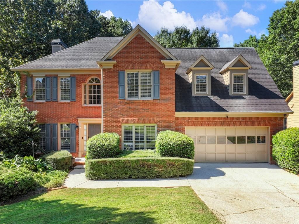 BEST VALUE IN JOHNS CREEK!! This SPACIOUS 5/3/1 home sits on a FULL, DAYLIGHT, UNFINISHED BASEMENT! TWO BRAND NEW HVAC SYSTEMS INSTALLED IN 2022! Welcome to this wonderful home in the heart of Johns Creek, known for its excellent schools, convenient location, and wonderful community. Step into a 2 story foyer flanked by elegant dining room and formal living room/study, all featuring real hardwood floors that run throughout the main level. The great room features a cozy fireplace and flows seamlessly into the breakfast room and kitchen boasting abundant custom cabinetry, granite countertops, chef's island, and stainless steel appliances- including a black s/s convection range with gas burners and dual ovens, and a wine refrigerator. Enjoy your morning coffee or unwind in the evenings in the screened-in sunroom with skylights, which opens to a grilling deck and stairs down to a private backyard. Upstairs, you will find 5 generously sized bedrooms, including an oversized primary suite with tray ceiling, separate his/ hers walk-in closets, dual vanities, soaking tub, and vaulted ceilings. One bedroom is being used as an office offering flexibility for your needs. The full, daylight, unfinished terrace level offers endless potential for a custom entertainment space, gym, or workshop- whatever suits your lifestyle (currently features a working 1/2 bath in basement). N'hood amenities include a pool, tennis courts, and playground. Don't miss this incredible opportunity!
