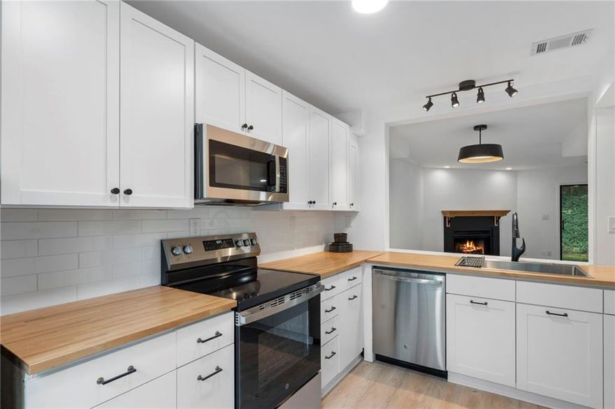 Welcome to this incredible find in the heart of Alpharetta! Freshly updated with brand-new flooring, lighting, kitchen appliances, butcher block countertops, and cabinets, this home is a rare opportunity at this price point and in this LOCATION.

With no rental restrictions, this is a turn-key choice whether you’re looking for your Alpharetta hideaway or an investment property.

The main level features a large single-basin sink overlooking the great room, a cozy fireplace, generous ceilings, and sliding doors that open to a private back patio. Upstairs, both bedrooms are well sized with ample closets and en-suite bathrooms; one featuring a private balcony. LVP flooring flows throughout the main level, with plush new carpet upstairs.

This is a rare, affordable option less than a mile from downtown Alpharetta and just two miles from Crabapple in Milton, with access to some of Georgia’s finest schools. Alpharetta's Farmers Market runs nearly year-round, with seasonal festivals and endless shopping and dining at Avalon, Crabapple, downtown Alpharetta, Milton, and Roswell’s Canton Street, everything you love is just minutes away!