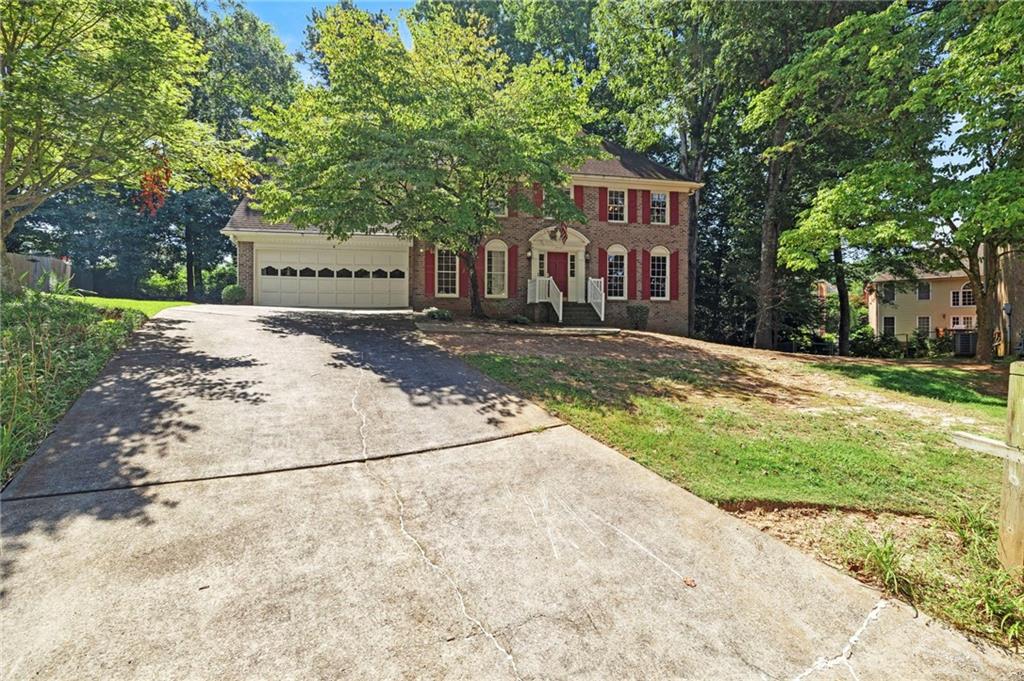 Investor bring your contractors and designers, don’t miss this rare opportunity in one of Tucker’s most desirable and rapidly appreciating neighborhoods. Lo Four-sided brick home, offers over 3,100 square feet of finished living space plus an additional 1,100+ square feet in the full, unfinished basement, providing limitless potential for expansion and a two-car garage. Built in 1983 and owned by the same family since 1986, the home features five bedrooms and three full bathrooms, including a main-level bedroom and full bath, a vaulted family room with fireplace, a sunroom addition off the kitchen, and a separate dining room. Upstairs, the oversized primary suite includes his-and-hers walk-in closets, with two additional bedrooms, a full bath, and a large bonus room or 5th bedroom accessible via a second staircase. The home is in need of TLC and cosmetic updates and is priced accordingly—perfect for investors looking to flip, hold, or renovate and occupy. The full basement offers incredible space for a workshop, home gym, theater, or future in-law suite. A brand-new water heater (2025). No HOA make this an ideal rental or resale opportunity. Conveniently located near Henderson Park, trails, a lake, soccer fields, and just minutes from downtown Tucker, Main Street, I-285, and I-85. Pine Cove is a quiet, established enclave in the heart of a thriving community with strong demand and ongoing revitalization. This is the value-add project you’ve been waiting for in Tucker.