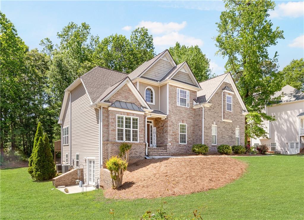 Welcome to this magnificent property in Douglasville, offering luxurious living and an abundance of space. This stunning residence boasts 5 bedrooms, 4.5 bathrooms, and a full finished basement, providing the perfect blend of elegance, comfort, and functionality. The striking brick front façade adds timeless charm and curb appeal, setting the stage for a truly exceptional home. Upon entering, you'll be greeted by a grand foyer, which leads you to the heart of the home—a spacious and inviting living area. The open-concept design seamlessly connects the living room, dining area, and kitchen, creating a perfect space for entertaining guests or enjoying quality time with family. The kitchen is a chef's dream, featuring stainless steel appliances, ample cabinetry, and a breakfast bar. Whether you're hosting a formal dinner or preparing a casual meal, this well-appointed kitchen provides everything you need. The main level also includes a separate formal dining room, an ideal space for special occasions or intimate gatherings. Additionally, a private home office/study is available, providing a quiet and productive environment. You'll also discover on the main level, the expansive master suite, a true sanctuary for relaxation. This serene retreat features a spacious bedroom area, a walk-in closet, and a luxurious en-suite bathroom complete with a soaking tub, a separate shower, and dual vanities. Four additional bedrooms provide ample space for family and guests, each thoughtfully designed with comfort in mind. The well-appointed bathrooms throughout the home offer modern fixtures and finishes, ensuring a touch of sophistication. The lower level boasts a full finished basement, providing endless possibilities for entertainment and recreation. Create a home theater, a game room, and additional living area—the choice is yours. The basement also includes a bathroom for added convenience. Outdoor living is a delight with a spacious backyard, perfect for hosting outdoor gatherings, children's play, or simply enjoying the tranquility of nature around your fire pit. The property also includes a two-car garage and ample parking space for guests. Located in the desirable city of Douglasville, this home offers convenient access to local amenities, shopping centers, dining options, and entertainment venues. With its exceptional features, spacious layout, and meticulous craftsmanship, this property truly embodies the epitome of luxury living. Don't miss the opportunity to make this extraordinary residence your forever home. Schedule a showing today and experience the grandeur and elegance that awaits you in this remarkable Douglasville property.