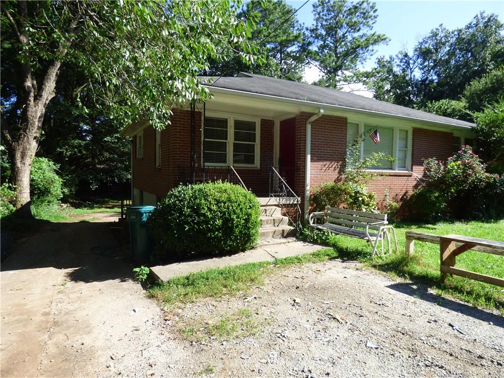 4 sides brick, 3 bedroom ranch home has separate living room/dining room, covered front porch, hardwood floors throughout on FULL unfinished basement. Investor owned, sold "AS IS" and no disclosure from seller. This home sits on a private lot in quiet neighborhood. Close to SunTrust Stadium, and shopping. Don't miss out on this fixer upper with tons of potential!