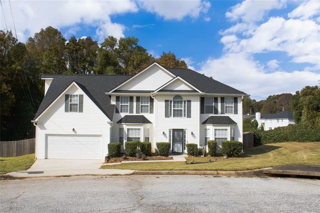 Welcome to 6232 Springwater Lane in Lithonia! This well-maintained, spacious home offers approximately 3,188 square feet of living space with five bedrooms and three bathrooms. The main level features one bedroom on the main, ideal for a variety of living situations, dining area, living room, kitchen and family room. Upstairs, you’ll find the owner’s suite as well as three additional bedrooms, one of which is a spacious flex-bedroom with an additional staircase attached.
The home is situated on nearly an acre, the property features a huge backyard, deck and shed with plenty of room for outdoor activities. Conveniently tucked away in a serene residential neighborhood located near schools, shopping centers and within minutes of Arabia Mountain Park and Stonecrest Mall.