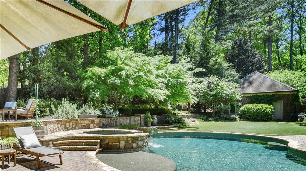 Gorgeous Morningside estate property on neighborhood’s most desirable street. Almost 3/4 acre lot allows for exceptional outdoor amenities and privacy. The completely renovated and expanded Tudor of over 8k square feet includes an award winning kitchen, state of the art sound and lighting, a resort style pool and a sommeliers wine cellar. Other exceptional amenities include a parking court at kitchen level with 4 garages, huge primary suite with separate living room, fire pit, outdoor television, and oversized secondary bedrooms.