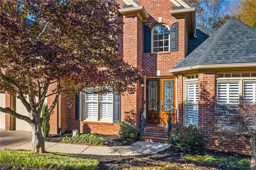 A Rare Opportunity! Primary Suite + Second Bedroom with Full Bath on the Main Level.  Welcome to this beautifully maintained 3-SIDES BRICK HOME, built in 2002 and ideally situated in the desirable SUMMIT OAKS subdivision-within one of East Cobb's top-rated school zones: LASSITER HIGH, SIMPSON MIDDLE, and SHALLOWFORD FALLS ELEMENTARY.  Step inside to a bright, inviting interior highlighted by HIGH CEILINGS, a TWO-STORY FOYER, and a VAULTED LIVING AND FAMILY ROOM. The OPEN CONCEPT layout is perfect for both everyday living and entertaining. The spacious ISLAND KITCHEN overlooks the family room and breakfast area and features EXTENSIVE COUNTER SPACE, a RAISED BREAKFAST BAR, CENTER ISLAND, PANTRY, and a convenient BUTLER'S PANTRY. The main-level LAUNDRY ROOM includes a built-in ironing board for added convenience.  The impressive primary suite has a large bedroom with sitting area, trey ceiling, and the PRIMARY BATH ROOM is NEWLY RENOVATED with freestanding tub, frameless glass shower, private water closet, double vanity with quartz countertops, and large walk-in custom closet. The UPPER LEVEL offers a generous BONUS ROOM, two additional bedrooms, and a JACK-AND-JILL BATH, providing flexible space for family, office use, or hobbies.  NOTABLE FEATURES INCLUDE 4" PLANTATION SHUTTERS, HARDWOOD FLOORS ON THE MAIN LEVEL, NEW CARPET IN ALL BEDROOMS AND THE BONUS ROOM, FRESH INTERIOR PAINT THROUGHOUT, AND BUILT-IN BOOKSHELVES, all contributing to the home's move-in-ready appeal.  The expansive UNFINISHED BASEMENT with 9' ceilings, workshop area, storage shelving, and a cedar closet presents endless possibilities for future customization.  Enjoy year-round outdoor living on the COVERED DECK, overlooking your PRIVATE, WOODED LOT-no home behind you, just peaceful nature views. A lower-level patio and level backyard add even more usable outdoor space.  Buy with confidence: THE ROOF IS ONLY 4.5 YEARS OLD! This thoughtfully designed home offers comfort, style, generous space, and an unbeatable location in one of East Cobb's most loved communities. WELCOME HOME!