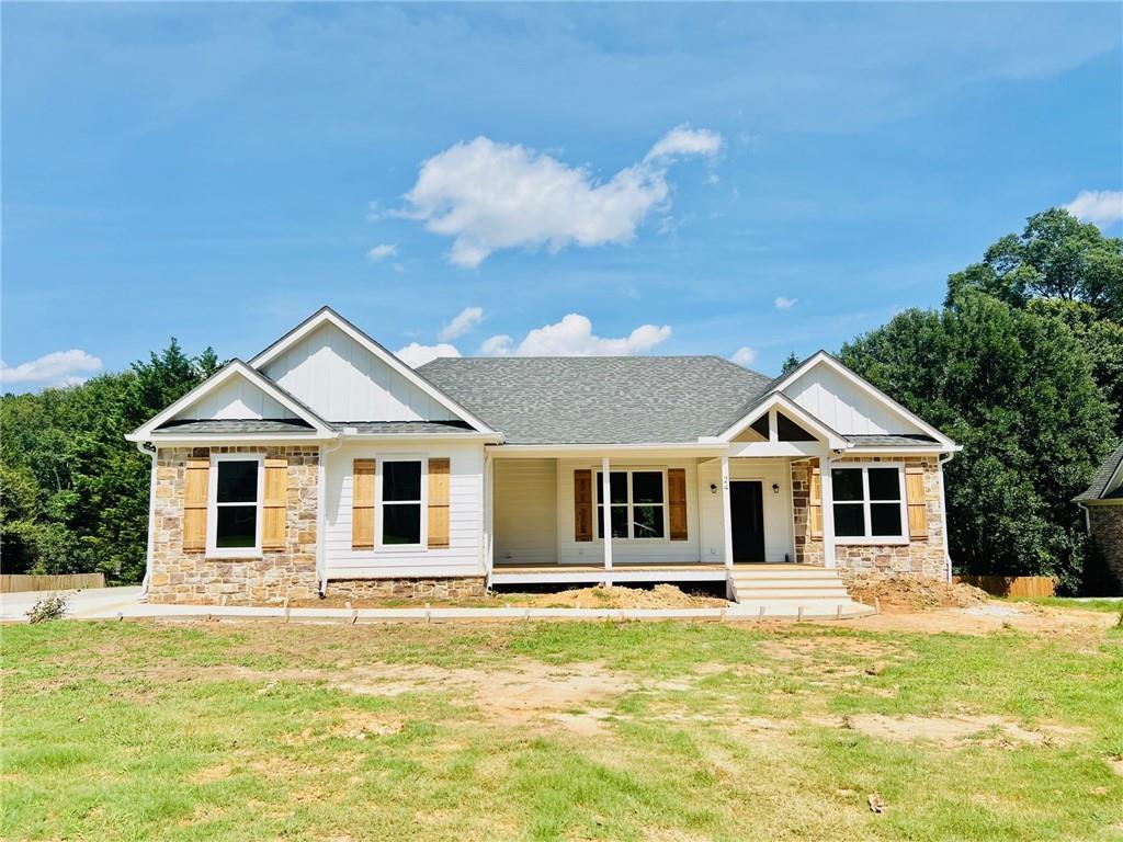 New construction ranch home over basement in peaceful and convenient location within Applewood Farms swim community. 3BR/2BA on main level. LVP flooring throughout, granite countertops in baths and kitchen, spacious rooms, gas log fireplace in living room, covered back deck with views of private backyard and beautiful front porch. Basement has a huge bonus room finished as well as a full bath with tile shower and bedroom. There is also a large bonus/family room, workshop area and other storage areas in the basement unfinished. Large, private backyard.
