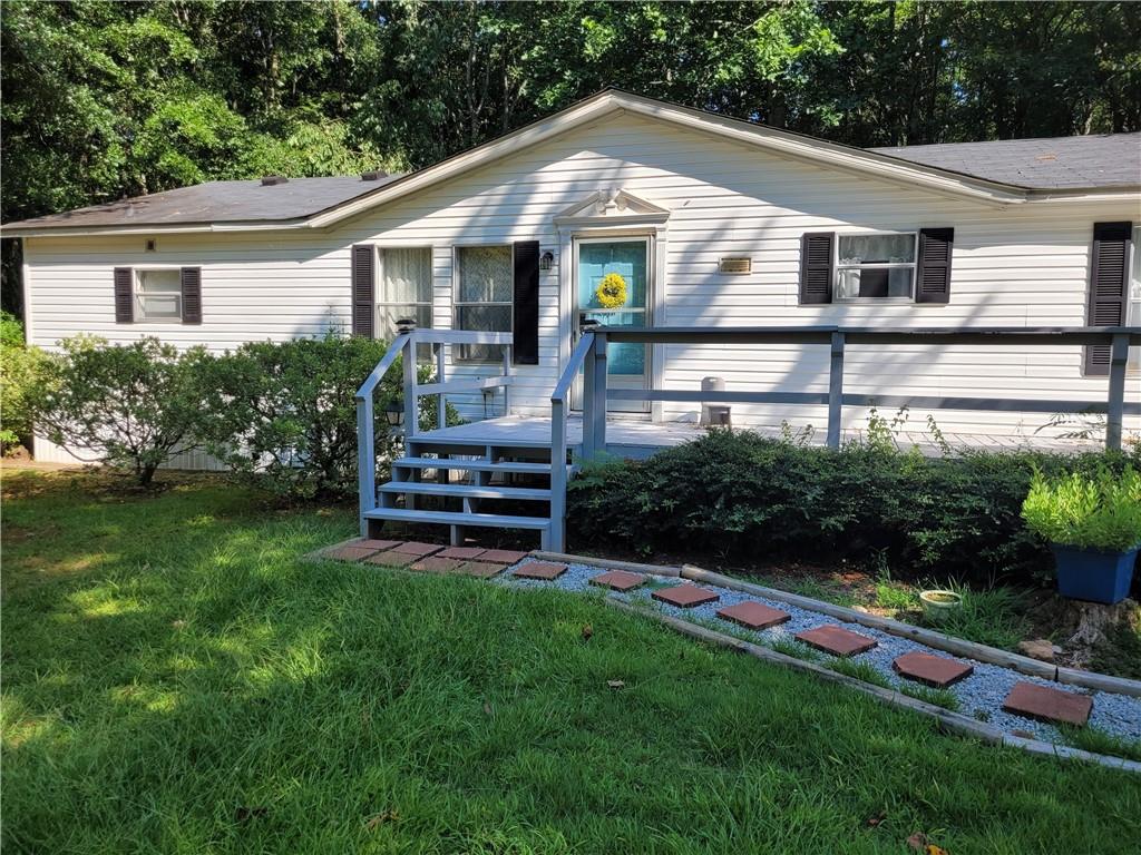 White siding exterior with a Light shingle roof