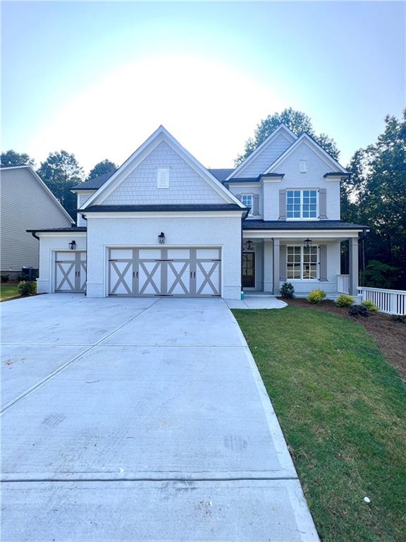 Welcome to your dream home in the highly sought-after North Gwinnett high School! This brand new, luxurious single-family home offers a perfect blend of modern design, high-end features, and an ideal location. With 4 bedrooms, 4 baths, and a 3-car garage, this home provides ample space for your family's comfort and lifestyle. The moment you step inside, you'll be captivated by the spacious and open layout, designed for seamless living and entertaining. The chef's kitchen is the heart of this home, featuring exquisite quartz countertops, double ovens, stainless steel appliances, and a chef's island. The kitchen effortlessly overlooks the family room, creating a warm and inviting space for gatherings and daily living. The family room boasts stunning beam ceilings and a cozy fireplace with built-in cabinets, providing the perfect ambiance for relaxation and entertainment. Hosting dinner parties is a breeze with the formal dining room and convenient Butler's Pantry, adding an element of elegance to every meal. One of the highlights of this home is the guest bedroom on the main level with an attached bath, offering a private retreat for visitors or extended family members. As you ascend to the second level, you'll discover the exquisite master suite, featuring a spa-style bath with quartz countertops, a beautiful glass-enclosed shower, a soaking tub, and an oversized walk-in closet. Two spacious secondary bedrooms provide ample space for family members, and there's even a media room/loft, perfect for entertainment or relaxation. The outdoor space is equally impressive, with a game day covered back porch featuring a fireplace - an idyllic setting for outdoor enjoyment and creating lasting memories with loved ones. The home is situated on a beautiful oversized lot, providing space for your own private oasis. This home is conveniently located near shopping centers, parks, and a wealth of amenities, ensuring that you're never far from the activities you love. Don't miss this incredible opportunity to rent a new construction home in the acclaimed North Gwinnett school district. With countless upgrades and luxurious finishes, this property offers everything you could desire and more.