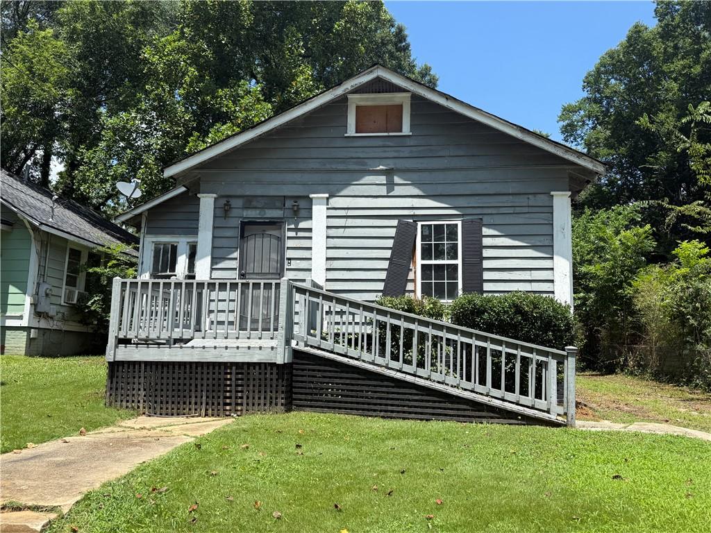 This 3-bedroom, 2-bath single-story home offers a fantastic chance to create your dream space or add to your investment portfolio. Featuring a welcoming front porch, spacious back deck, and tons of potential, this property is ready for your personal touch. With some TLC, this could be a gem. Don't wait schedule your showing today.
