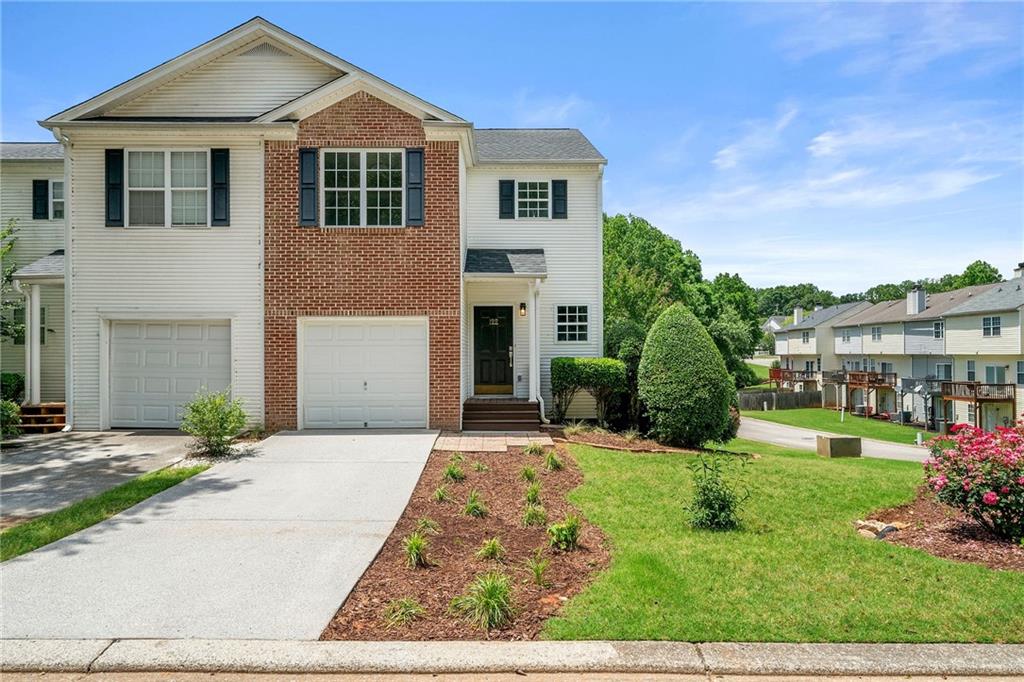 Luxuriously renovated 2-Story 3 BED 2 Full & 2 Half BATH Townhouse waiting for you! This is a highly sought after end unit with a finished basement! The brand new LVP flooring creates cohesion through the main floor fashioning a seamless flow from the entry way and opening to the kitchen and living areas. The kitchen now has gorgeous granite counter tops with new stainless steel appliances that are ready for chef! You and your favorite people can mingle together through the open concept living spaces that can easily spill onto the second story back deck. The door hardware, plumbing & electrical fixtures have been replaced and modernized. Lavish new carpet leads upstairs to 2 ensuite bedrooms both boasting bounteous space with generous walk-in closets. The bathrooms coax you to private, relaxation in opulence! In addition, the laundry room is perfectly situated to serve all the bedrooms. The freshly painted walls and LVP continue into the 3rd bedroom downstairs. This space is huge and can serve in a multitude of capacities. It even has its own door. You can rest easy knowing there is a new roof. Park conveniently in your garage or on the level driveway surrounded by revitalized landscaping. The proximity to downtown Hiram provides endless shopping, unparalleled eateries, the Silver Comet Trail, and more! Located so near highway 278, this home can simplify and shorten your commute or travel! Do not miss out on this gem tucked away in this lovely community! Schedule your private showing today! Includes Virtually Staged Photography