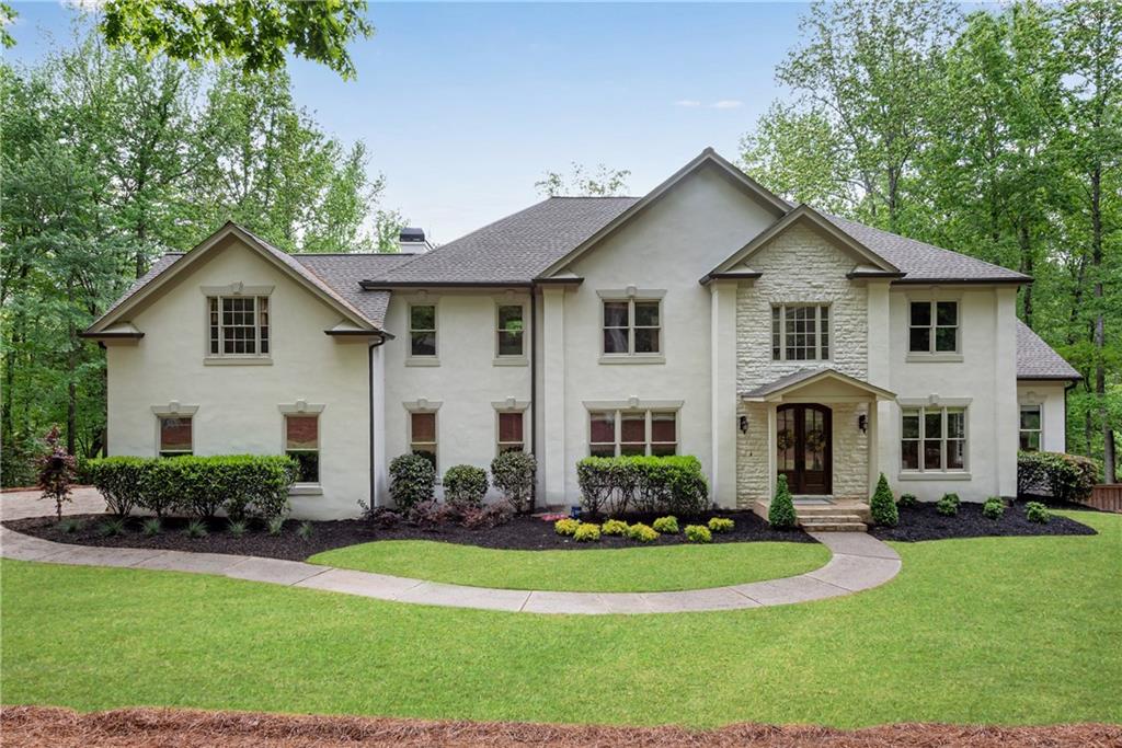 Rare Opportunity to Own a Beautifully Updated Estate Home on Nearly 3 Private Acres with a Saltwater Pool and No HOA—All in One of South Forsyth’s Most Desirable Locations! Nestled in an enclave of estate homes just minutes from Peachtree Parkway and located in the top-rated Denmark High School district, this expansive residence offers over 5,000 square feet of living space, featuring 5 bedrooms and 4.5 bathrooms, including two primary suites—one on the main level and one upstairs—ideal for multi-generational living. Completely renovated from top to bottom, this move-in ready home boasts new interior and exterior paint, refinished real hardwood floors, all-new carpet, and new ceiling fans. The kitchen has been tastefully refreshed with quartz countertops, a new gas cooktop, and a new refrigerator. Every bathroom has been stylishly updated, including free-standing tubs, new toilets, features a walk-in showers! Major systems have been replaced for peace of mind, including FOUR brand-new HVAC units, a 30-year architectural shingle roof (approx. 3 years old) with new roof decking, gutters, and trim, a 3-year-old hot water heater, and new decking and railings....basically nothing was left untouched! Step outside to your private backyard oasis featuring a sparkling saltwater pool and fresh new landscaping—perfect for entertaining or unwinding in total serenity. Hot Tub Included! This home offers the perfect blend of privacy and convenience, just minutes from The Collection, top-rated schools, dining, and shopping. Homes like this are rarely available—don’t miss your chance to make it yours!