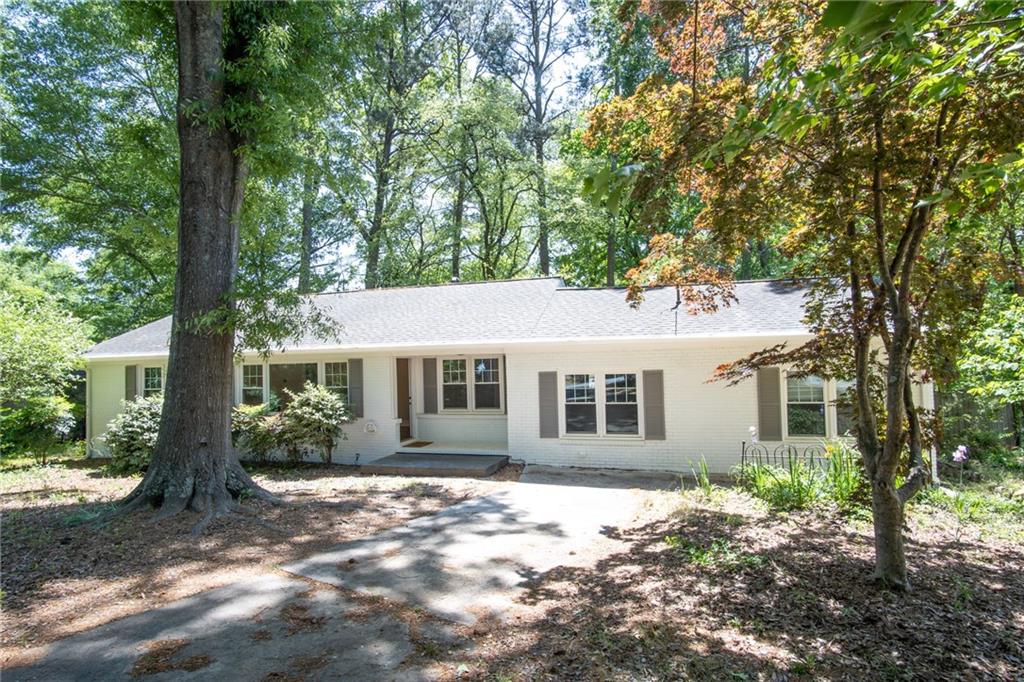 Renovated brick ranch in excellent location close to I-75 in historic Marietta near Truist Park, shopping, restaurants and more! This home is beautifully renovated with fresh paint, front door, new lighting with canned lights, updated kitchen and bathrooms, stainless steel appliances, breakfast bar with granite countertops, and a great view of the huge back yard!. Oversized deck also overlooks the flat, fenced back yard with a stone firepit! This home is gorgeous and won't last long! 

Property owner is a licensed agent in the state of Georgia