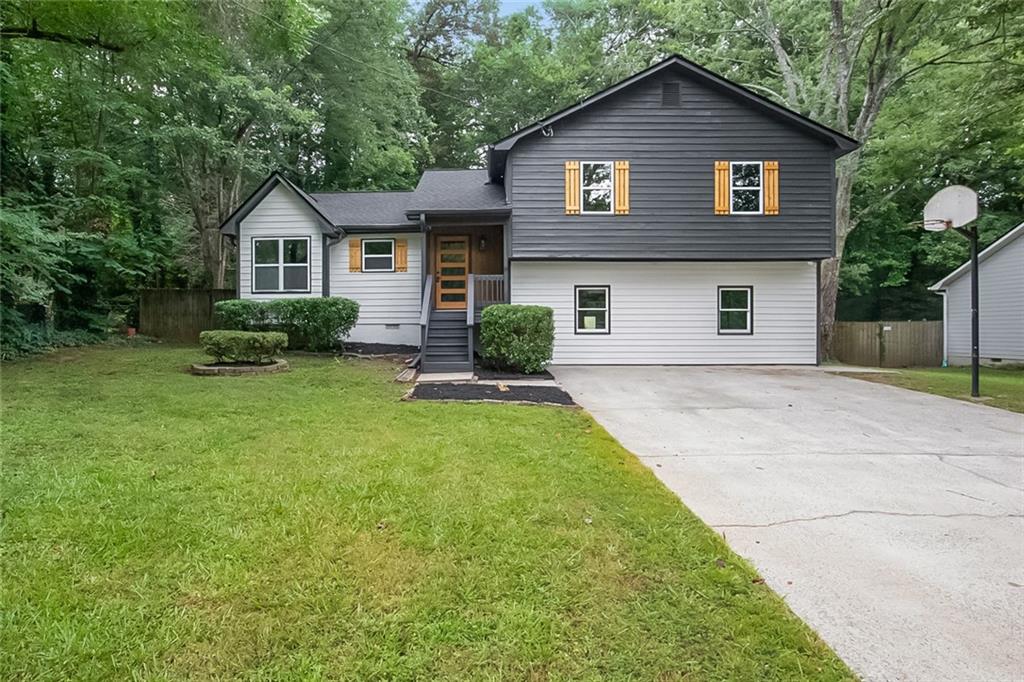 Welcome to 4050 Summit Wood Dr in Kennesaw, where every detail of this beautifully updated split-level home has been thoughtfully crafted for today's lifestyle. With 4 bedrooms, 3 full bathrooms, a finished basement, and over 2,000 square feet of living space, this home offers an ideal blend of function and modern design. The main level boasts an open-concept layout with incredible natural light, leading into a completely reimagined kitchen. Featuring an oversized island, custom cabinetry, premium countertops, designer backsplash, and brand-new stainless steel appliances, the kitchen is both stunning and highly functional. The entire home showcases high-end finishes, new flooring, fresh interior and exterior paint, designer light fixtures, and all-new systems including the roof shingles, water heater and more. The bathrooms are truly showstoppers-modern, elegant, and fully updated with beautiful tile work and upscale fixtures. The finished basement offers flexible living space and can function as the perfect fourth bedroom, guest suite, home office, or entertainment area, complete with its own full bathroom and ample storage. Step outside into a private backyard retreat featuring a newly upgraded in-ground pool with a brand-new liner and pump system-ideal for entertaining or relaxing in peace. Located in a desirable and quiet Kennesaw neighborhood, this home sits within a top-rated school district and is just minutes from shopping, dining, parks, and major highways. Whether you're upsizing, relocating, or simply seeking a stylish turnkey property, this home delivers on every level. Everything is brand new. The layout is open and functional. The finishes are modern and elevated. Seller's offering 1 year home warranty from a home warranty company up to $1,000! This is the one you've been waiting for!