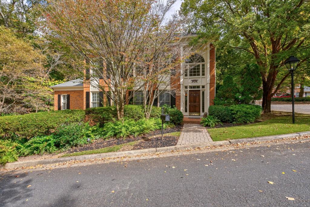 Beautiful all brick traditional home in the stunning Paces Battle community. This home offers primary bedroom suite with trayed ceilings on the main level,  large bathe and two walk-in Closets. Sun filled high ceilings family room with marble surround fireplace and banquet sized dining room. Hardwood floors have just been refinished on main level. Kitchen with Kitchen Aid appliances opens to breakfast area leading to the outdoor New three level deck with covered loggia area. The views from the deck are private and full of nature. This is an exceptional lot and feels a lot larger than it is. The upper level has three bedrooms and two full baths. The terrace level has a large family room with built-in's, two car garage, laundry room with extra refrigerator and wine storage room. Gas lanterns line the street on your walk to the river Or the pool. This is a hidden gem!