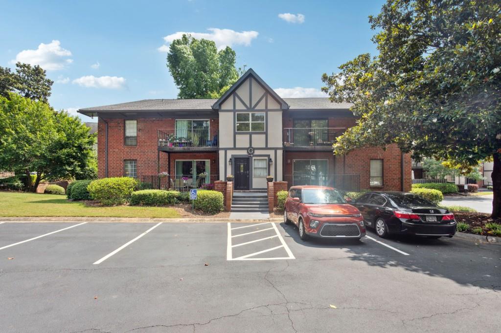 This one is ready to call home! Walk in level, nicely updated 1 bedroom/1 bathroom unit with super cute balcony. Ideally located in G building with covered balcony and close to guest parking. The balcony is a great space to enjoy your morning coffee or afternoon wine. This unit has wonderful open floor plan with a large master suite and huge walk-in closet. Comes complete with full size washer and dryer conveniently located in master walk in closet. Great location in Sandy Springs! This unit is truly a hidden gem in Sandy Springs. (Complex is not FHA approved). One bedroom unit comes with one owner parking spot.