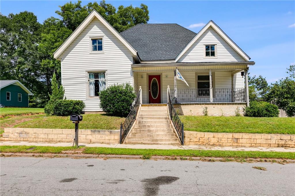 Here is your chance to own a piece of history in downtown Bremen! Step back in time with this classic 1920s historic home full of character and potential, including touches like original leaded glass accent windows and a large, traditional covered front porch. Featuring 3 spacious bedrooms, 2 full baths, and a dedicated laundry room, this property offers the perfect canvas to restore and customize into your dream home. Recent updates include newer roof (installed 2021), updated plumbing, electrical, and ductwork, and double-paned windows. The home boasts timeless details and the opportunity to bring it back to its former glory. Located in a prime spot, you’ll enjoy easy access to shops, dining, and community events while being part of one of the area’s top-rated school districts. Three storage buildings remain; all have electricity, giving you options for an on-site workshop in the spacious backyard. Oversized, newer deck creates the ideal outdoor living space. Whether you’re an investor, history lover, or a family looking for a home with character, this property offers unlimited potential in a location that can’t be beat. Don’t miss your chance to own a piece of Bremen’s history — schedule your showing today!