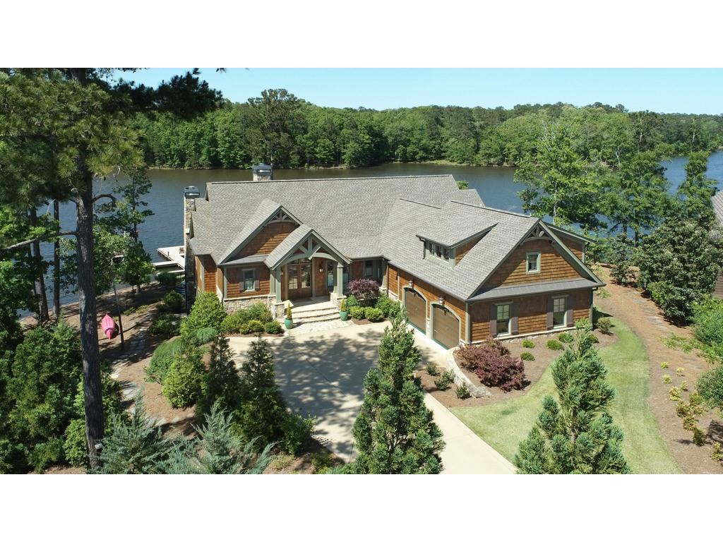 Surround yourself in the natural beauty of world-class Reynolds living in this custom lake house completed early 2018. Located just 90 minutes from Atlanta & international airport, Reynolds offers luxurious family friendly facilities, restaurants, 6 golf courses, Sandy Creek sports complex all surrounding the beauty of Lake Oconee. Classic lake house design w/stained cedar shake & stone is in the desirable Richland Creek area w/deep water. The Lake Club, Marina & Ritz Carlton are all a short boat ride away. Set on the point of Angel Pond E. w/ spectacular water views on 3 sides & privacy.Main floor offers open floor plan, custom cabinets, vaulted ceilings, arched beam accents & Wide plank pine floors. The Chefs Kitchen w/ island, gas cooktop, walk in pantry & adjacent casual family dining area are all open to the fireside great room that opens up to the stunning Screened Porch w/ gas stone fireplace & additional dining area overlooking the lake. Fireplace mantles are reclaimed antique beams.  Owners Suite on the Main Level has vaulted ceilings, arched beams, private balcony & spectacular lake views. Ensuite bath w/double sinks, lavatory room, walk in closet. Additional bedroom/Office w/ EnSuite bath on the main level with French doors onto screened porch. Terrace level is open to the yard w/stone gas fireplace & has a large rec room with wet bar, separate game room with pool table. In addition, it has 3 more bedrooms each with their own bathrooms & Lake Views.  Additional Suite above the garage has Ensuite bath, walk-in closet & storage. Saltwater pool is of a size that can easily be heated for use in a couple of hours year-round. Dock and beautifully landscaped yard await you. 4 HVAC, dual gas tankless water heaters. Golf membership Available