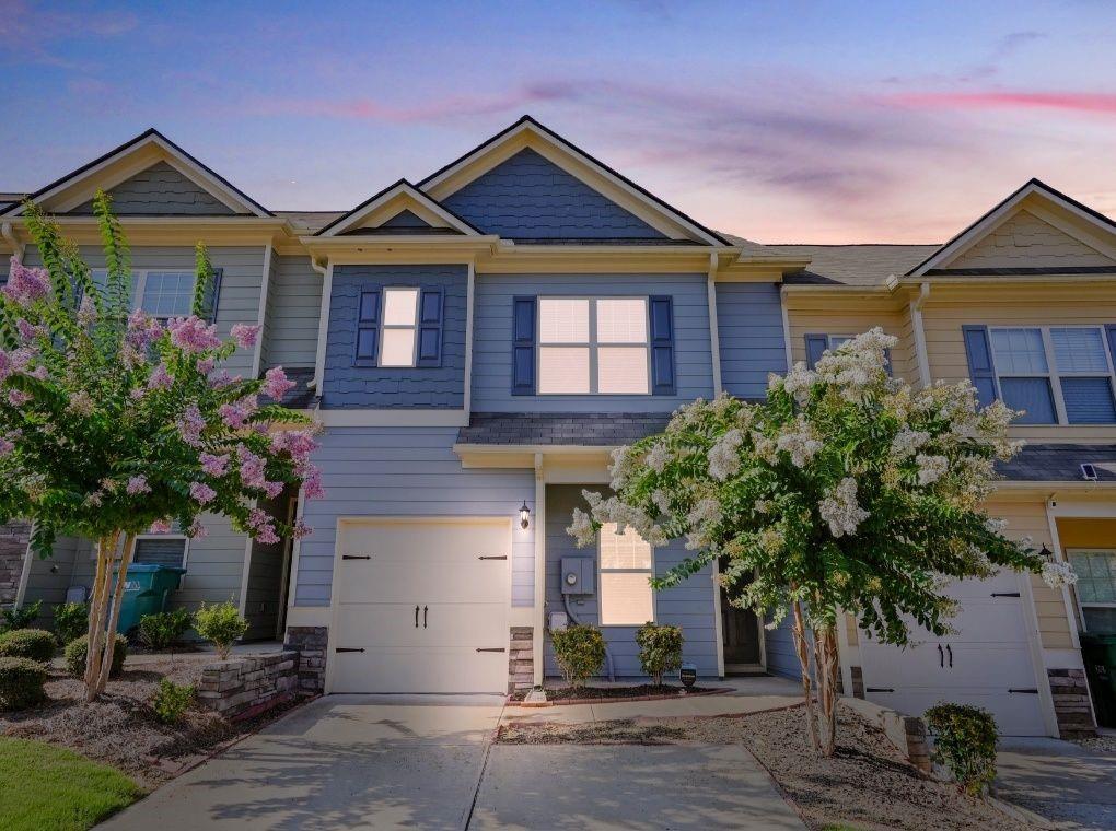 Prepare to be charmed by this beautifully maintained craftsman-style townhome, built in 2020 and located in one of the area’s most desirable communities—where the amenities are as fabulous as your favorite brunch spot (minus the long wait times).
Enjoy resort-style living with a swimming pool for those summer cannonballs, tennis courts to unleash your inner Serena, a friendly clubhouse perfect for mingling, a lively playground for the kids to burn energy, and even a dog park so your pup can finally make some four-legged friends.
Inside, the layout is open and inviting. The spacious main floor flows effortlessly and includes a bonus flex space—ideal for a home office, study nook, or that sacred “do-not-disturb” zone. Upstairs, you’ll find a large primary suite with soaring ceilings, two generous secondary bedrooms, and a convenient laundry area, so you can finally stop trekking downstairs in mismatched socks.
With 2.5 bathrooms, a one-car garage, and driveway parking for two more vehicles, this home checks both the style and practicality boxes. The private concrete patio is perfect for relaxing outdoors or hosting a casual weekend cookout—BYOB (Bring Your Own Burgers).
Bonus: yard and grounds maintenance are included, meaning you can spend weekends relaxing instead of waging war with the lawnmower.
Located just minutes from I-575 and a short drive to Woodstock, Canton, The Outlet Shoppes at Atlanta, The Mill on Etowah, and Canton Marketplace—plus great parks and trails. This home makes it easy to love where you live, blending charm, comfort, and convenience in one perfect package.