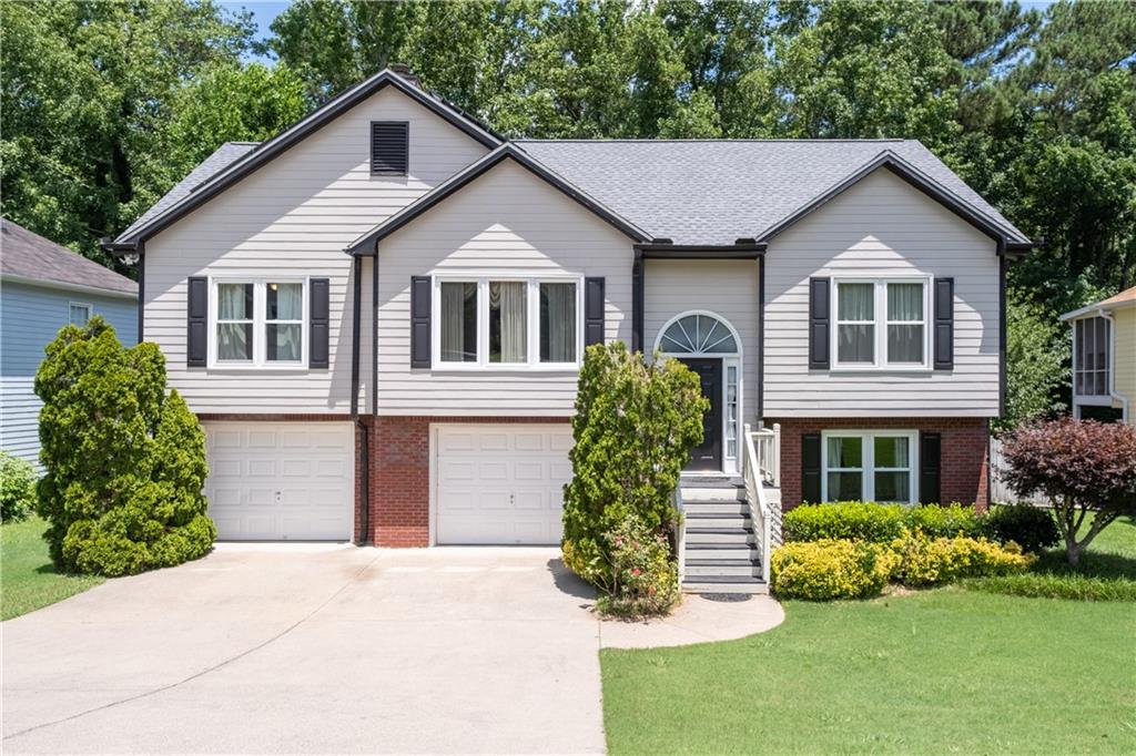 Welcome to 4780 Baker Plantation Drive in Acworth, GA – a well-maintained 4-bedroom, 3-bath home offering a spacious open floor plan and modern amenities in a convenient location. The bright and inviting layout features a large living area that flows seamlessly into the dining space and kitchen, making it ideal for entertaining or everyday living. The primary suite includes a private en-suite bath, while three additional bedrooms provide plenty of space for family, guests, or a home office. Enjoy outdoor living on the large deck overlooking a peaceful backyard. The home also includes a two-car garage and comes equipped with **solar panels**, which significantly reduce the monthly electric bill, offering long-term energy savings. As an added bonus, **lawn maintenance is included and paid for by the owner**, ensuring a low-maintenance lifestyle. Located close to shopping, dining, parks, and major highways, this home combines comfort, efficiency, and convenience. Don’t miss the chance to make this energy-efficient home yours!