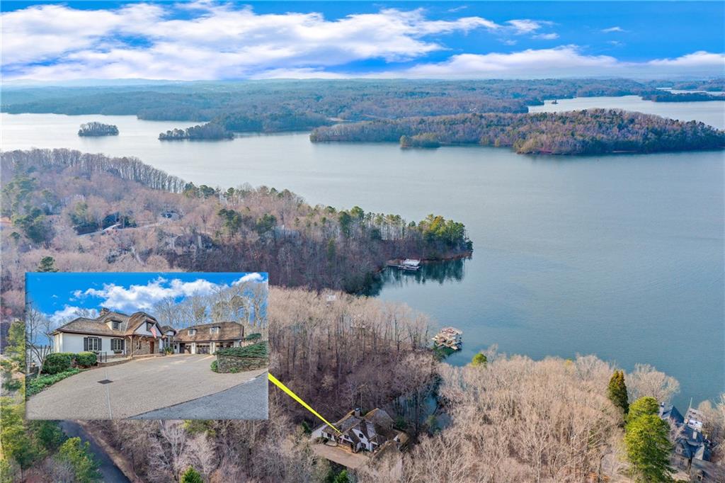 Prepare to be wowed by this Lake Lanier estate, never before on the market. Almost 2 acres (1.9), nestled in a quiet cul-de-sac, a rare combination of expansive waterfront views, deep water, mountain views, a US Corp line close to the water and a location convenient to Atlanta via GA 400 and Gainesville. It's an easy walk to the deep water, double slip dock. The home's design, inspired by a French country home, features a classic open floor plan enriched with massive wooden beams, creating a warm and inviting ambiance. Built for entertaining, the main level great room is open to the kitchen and dining area and opens to a sunroom with incredible long range views. The loft with built-in bookshelves is a lovely escape as a reading room or library. You'll be everyone's favorite host with a terrace level that can easily host a huge crowd with its own kitchen, fireplace and screened porch. Don't miss the large bonus room/office that makes this the perfect place to work from home. With its own fireplace and lake views, you will never want to work outside the home again. There is an additional lakefront lot available with its own deep water dock. Convenient not only to GA 400, but also to Gainesville, Northeast GA Medical Center and 985.
