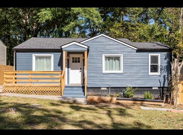 Hapeville cottage that has been boldy renovated! None of your run-of-the-mill upgrades, this timeless aesthetic will LAST! Neutral base with pops of color. Entry has a stained porch the size of a small deck with trellis underneath. Entry draws you in with the open floor plan. Family room is anchored by the wood accented wall and modern ceiling fan. Kitchen boasts quartz counter tops, white shaker cabinets with brushed gold hardware, stainless appliances and mounted range hood. LED lightin and pendants over the island doubles as a breakfast area with additional cabinet storage. Bedrooms are larger than expected at this square footage and the bathroom has a marble-tiled shower modern fixtures and ebony hardware. Top it all off with a privacy fenced backyard. **DO NOT DISTURB THE TENANTS**
