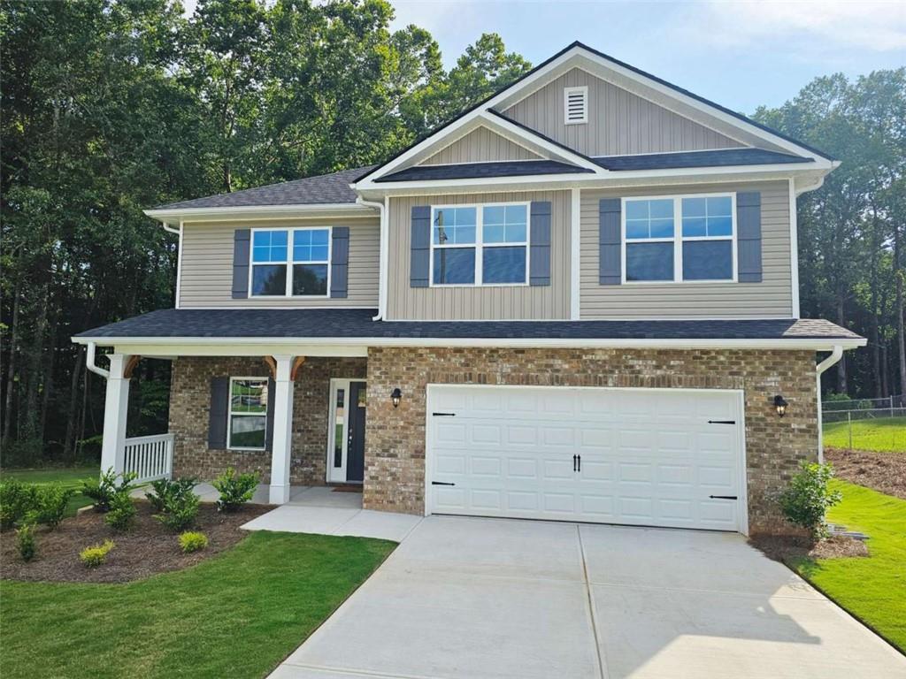 Welcome to "The Oakridge Haven" - A Spacious 4BD/2.5BA 2307 sq ft Retreat in Scarlett Place! cul-de-sac retreat! This two-story home features an open-concept living area, granite countertops with tile backsplash, main-level master suite with separate tub & shower, and a versatile upstairs rec room. Standard features include full sod front & back, 30-year shingles, brick-front exterior, 51/4 baseboards (even in the garage), tray ceiling in master, garbage disposal, and more. Covered patio perfect for relaxing outdoors. No HOA, USDA eligible, only $1,000 earnest money! **Price Reflects Builder Incentive**