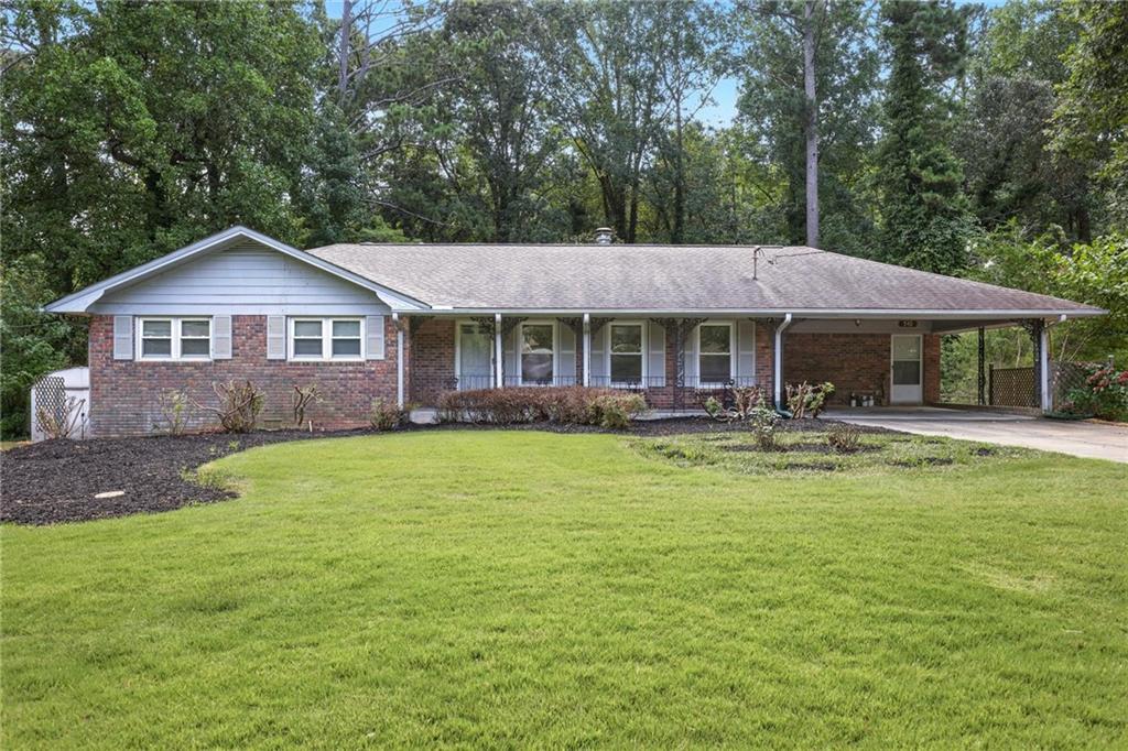 Charming 1968 brick ranch nestled on a private lot featuring 4 spacious bedrooms and 3 full bathrooms. This timeless home boasts a full finished basement, offering additional living and entertainment space. Enjoy serene views and outdoor relaxation in the fully fenced backyard, complet with a peaceful fresh water stream. Perfect for gatherings or quiet moments, this property blends classic charm with modern comforts.