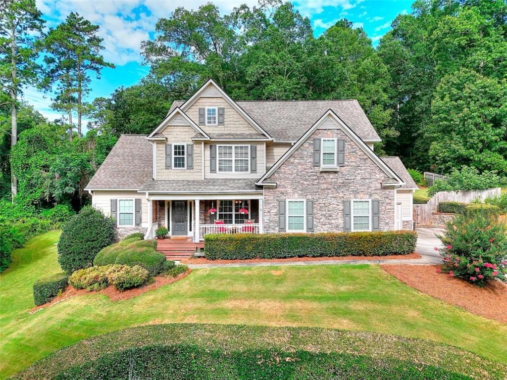 Welcome to this beautifully maintained 5-bedroom, 3.5-bath home located on a private .67-acre cul-de-sac lot with an above ground pool. This property features an open and functional floor plan with generous living areas, a large kitchen with ample storage and prep space, separate dining, and a main-level primary suite with en-suite bath including double vanities, soaking tub, and separate shower. Three additional spacious bedrooms are located upstairs and offer versatility for office or living space. Downstairs includes a dedicated media room with projector for movie nights along with high-top bar and sink that are perfect for entertaining. Also located downstairs is an additional full bedroom and bath with exterior entry. This home includes a large, fenced backyard with an above-ground pool, ideal for relaxing and summertime fun. Located in Loganville school district and convenient to local shopping and dining.