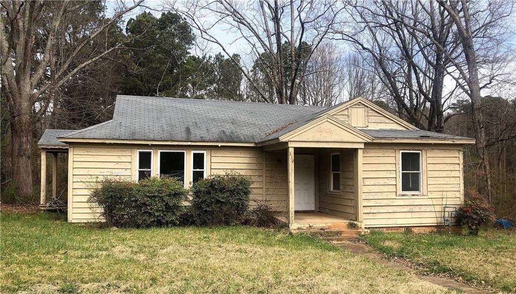 **Incredible Opportunity!** Unlock the potential of this charming fixer-upper bungalow or consider a complete rebuild to suit your vision. This property includes a massive barn/storage building, perfect for various uses. Nestled on 1.28 acres with 125 feet of prime road frontage, it offers unparalleled convenience, being less than a mile from the FOCO Courthouse and within the Cumming city limits. Additionally, this property holds potential for commercial development, making it an even more attractive endeavor. Don't miss out on this rare chance to create your dream property in a highly desirable location!