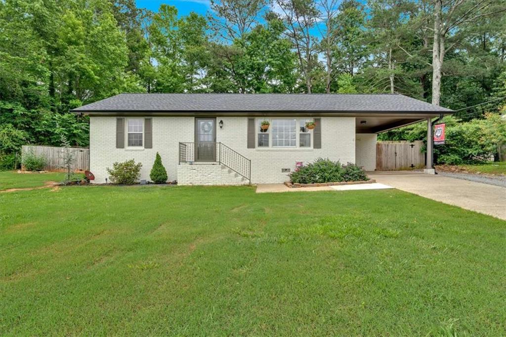 Charming Remodeled Brick Ranch in the Heart of Carrollton! Welcome to this beautifully remodeled brick ranch, perfectly situated in the heart of Carrollton City-just minutes from shopping, dining, schools, and all the conveniences you need! This move-in ready home boasts a brand-new roof, stylish updates throughout, and thoughtful finishes that blend modern comfort with classic charm. Step inside to discover a bright, open layout with updated flooring, fresh paint, and a fully renovated kitchen and bathroom. Whether you're entertaining or enjoying a quiet evening at home, the inviting living spaces are designed for everyday comfort and ease. Out back, enjoy a private, fenced-in yard-perfect for pets, play, or peaceful relaxation. A small outbuilding provides additional storage or workshop space, giving you even more flexibility. Don't miss this rare opportunity to own a remodeled home in one of Carrollton's most convenient and desirable locations. Schedule your showing today!